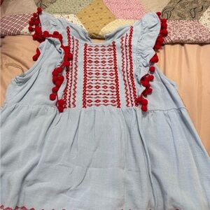 Blue Top with Red Pom Pom Details